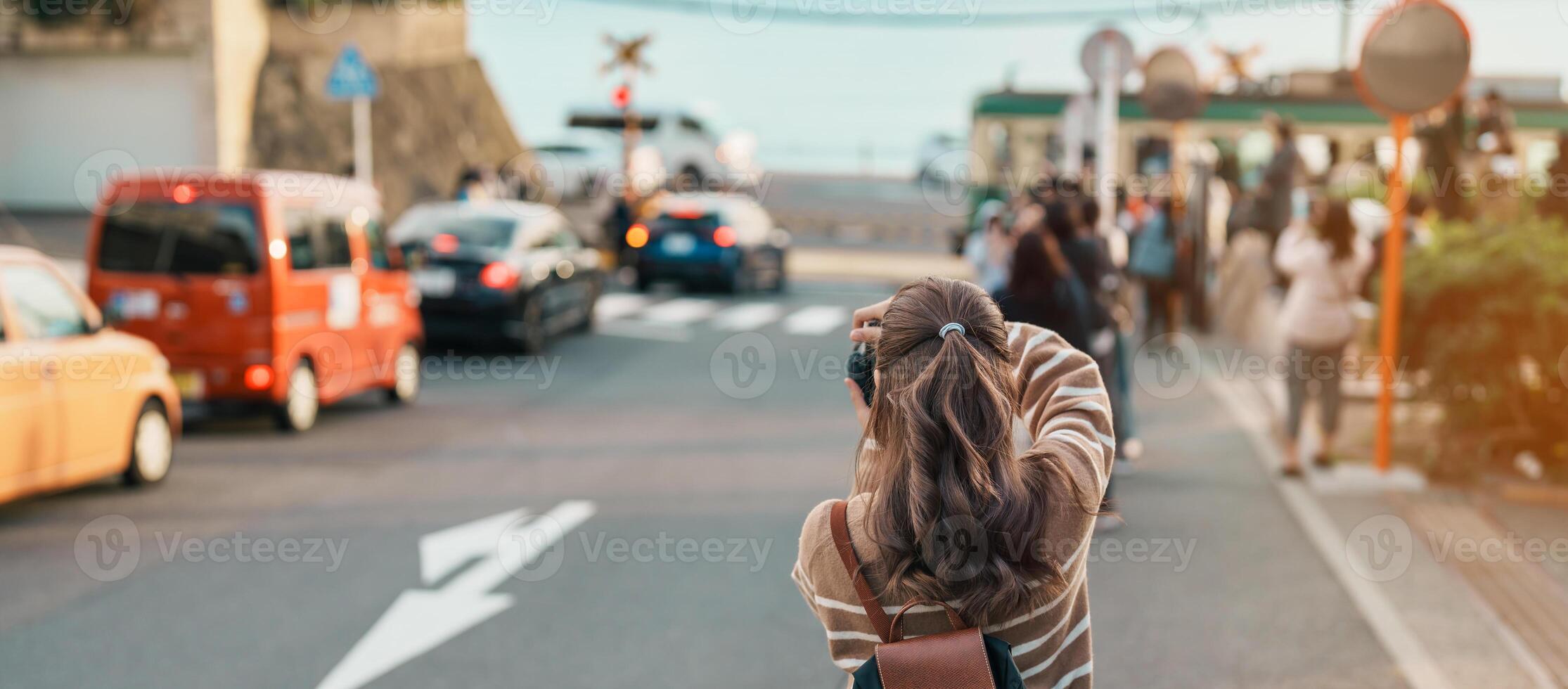 Woman tourist Visiting in Kamakura, Kanagawa, Japan. happy Traveler sightseeing Kamakurakokomae train station. Landmark and popular for tourists attraction near Tokyo. Travel and Vacation concept photo