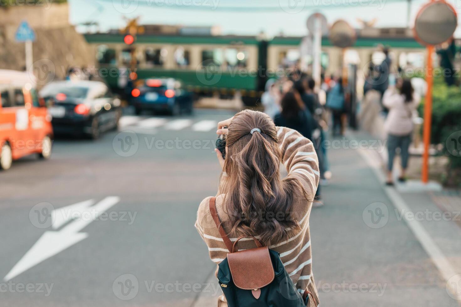 Woman tourist Visiting in Kamakura, Kanagawa, Japan. happy Traveler sightseeing Kamakurakokomae train station. Landmark and popular for tourists attraction near Tokyo. Travel and Vacation concept photo