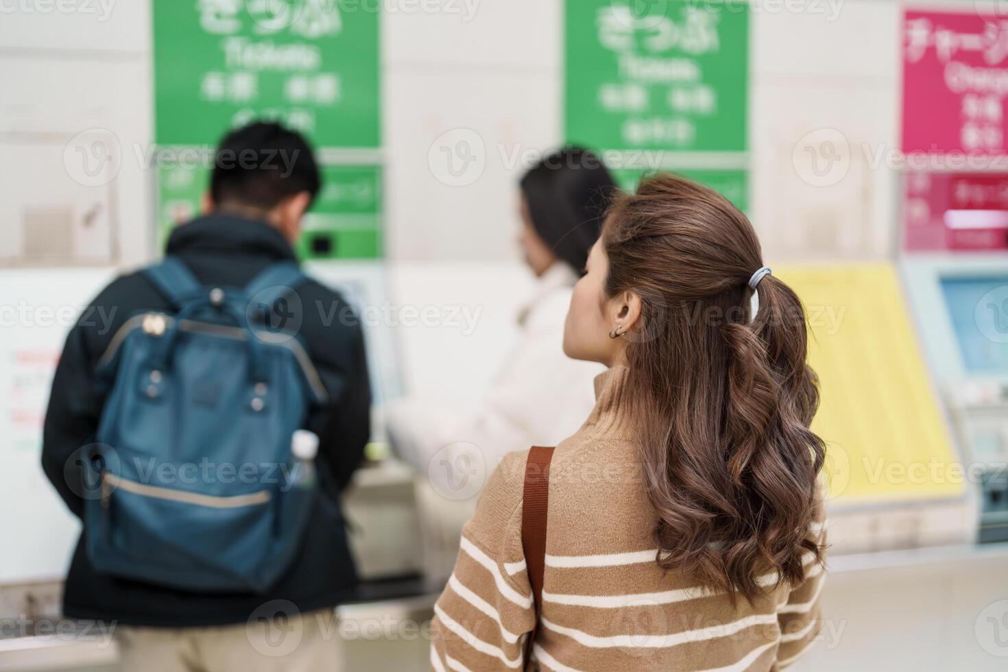 Woman tourist buy Ticket at automatic machine at Enoshima station, Enoshima Dentetsu train Line in Kamakura, Japanese railway connects Kamakura with Fujisawa Station in Fujisawa, Kanagawa photo