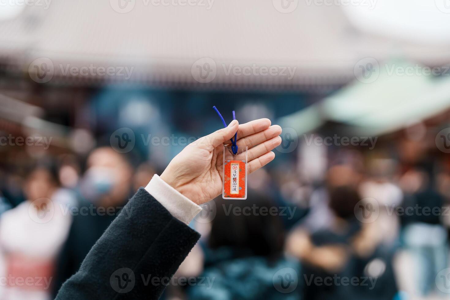 tourist show Japan souvenir Omamori. Traveler visit Sensoji Temple or Asakusa Kannon Temple is a Buddhist temple located in Asakusa, Tokyo Japan. Japanese sentence means Healthy photo