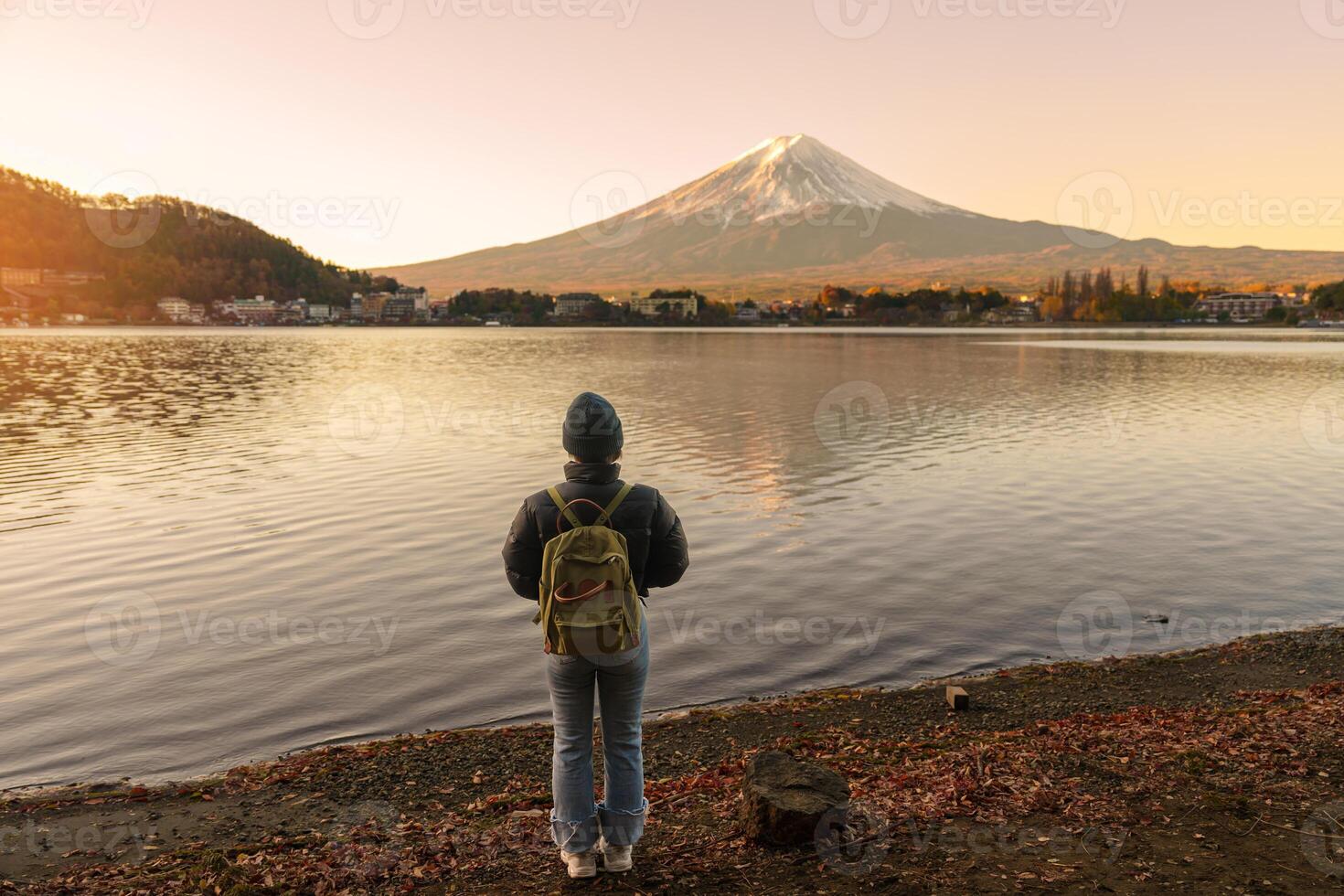 Woman tourist with Fuji Mountain at Lake Kawaguchi, happy Traveler sightseeing Mount Fuji in Fujikawaguchiko, Yamanashi, Japan. Landmark for tourists attraction. Japan Travel, Destination and Vacation photo