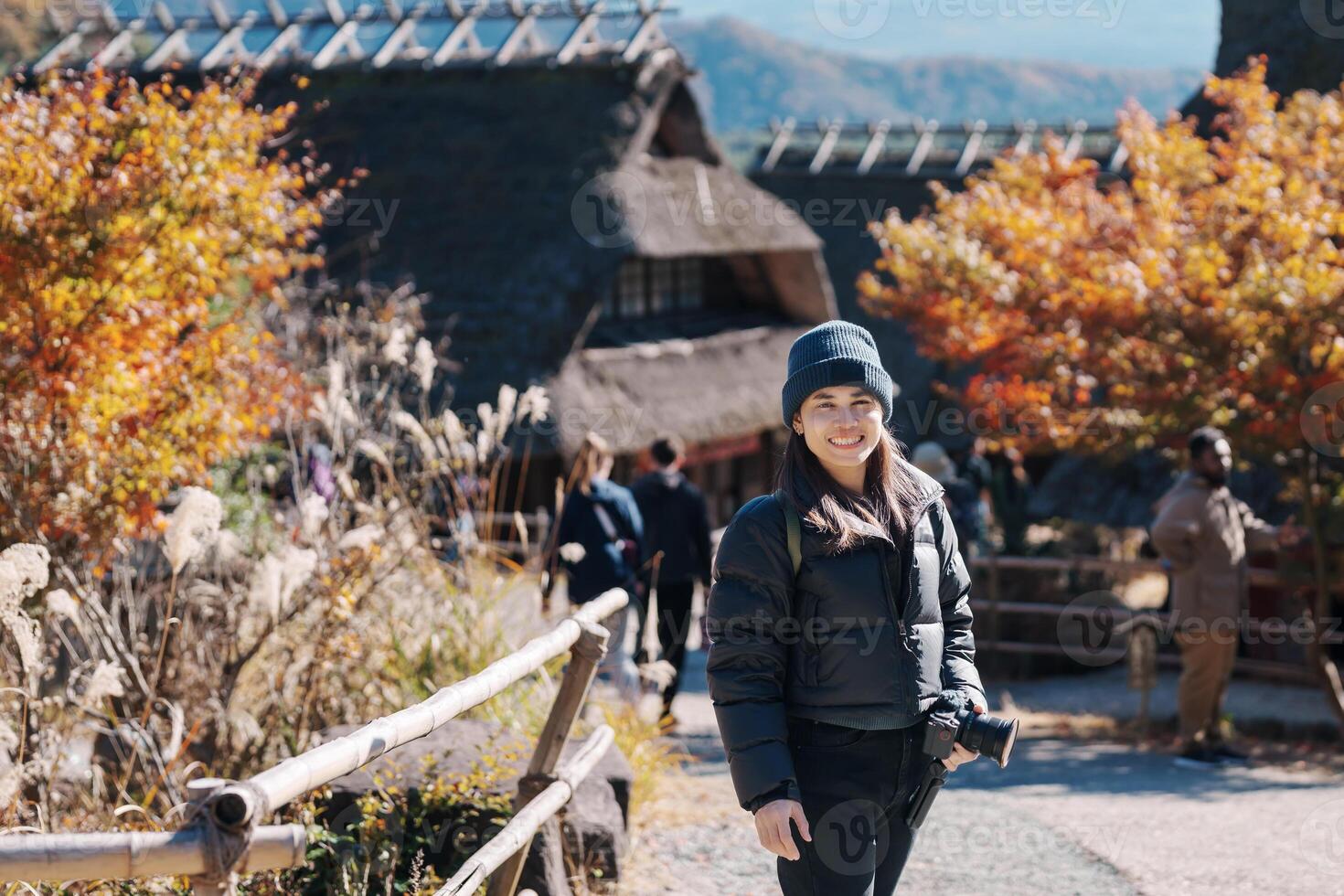 Woman tourist with mount Fuji at Saiko Iyashino Sato Nenba in Autumn season, happy Traveler travel Mt Fuji, Yamanashi, Japan. Landmark for tourist attraction. Japan Travel, Destination and Vacation photo