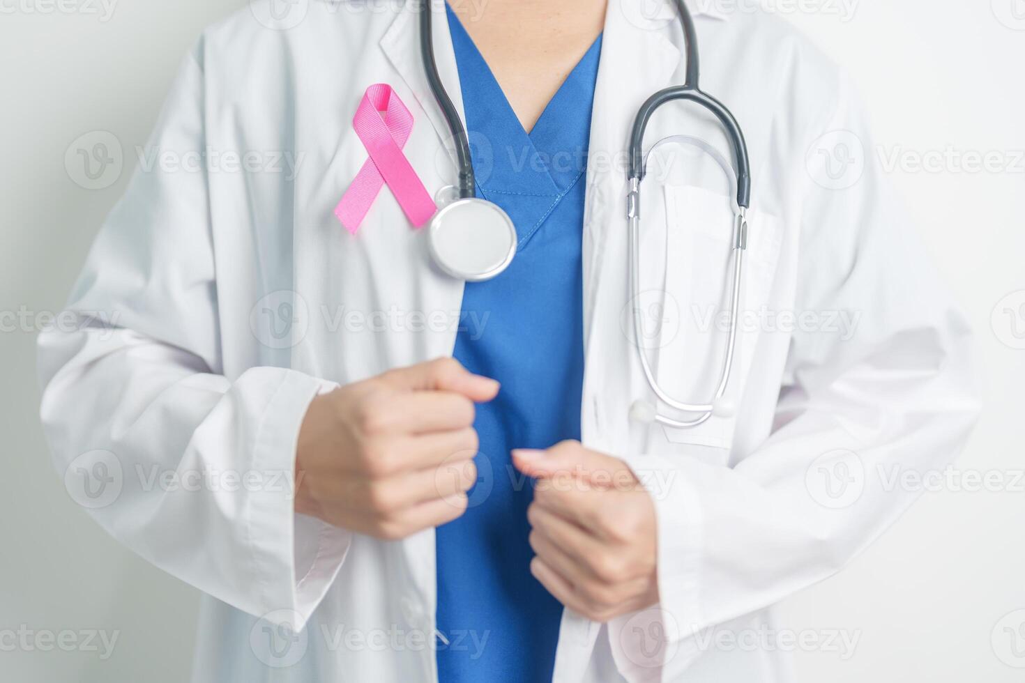 Pink October Breast Cancer Awareness month, woman doctor with pink Ribbon in hospital for support people life and illness. National cancer survivors month, Mother and World cancer day concept photo