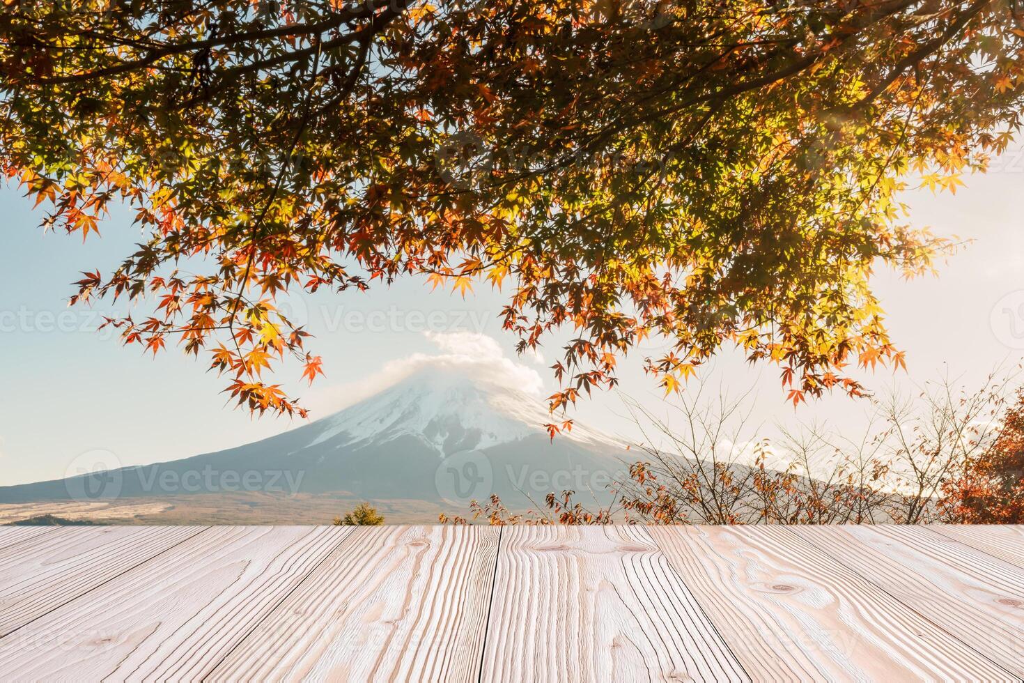 Empty wood table mockup with Mount Fuji view at Kawaguchiko lake background and copy space for text, Mock up for your product display and montage in autumn season. Japan travel and vacation concept photo