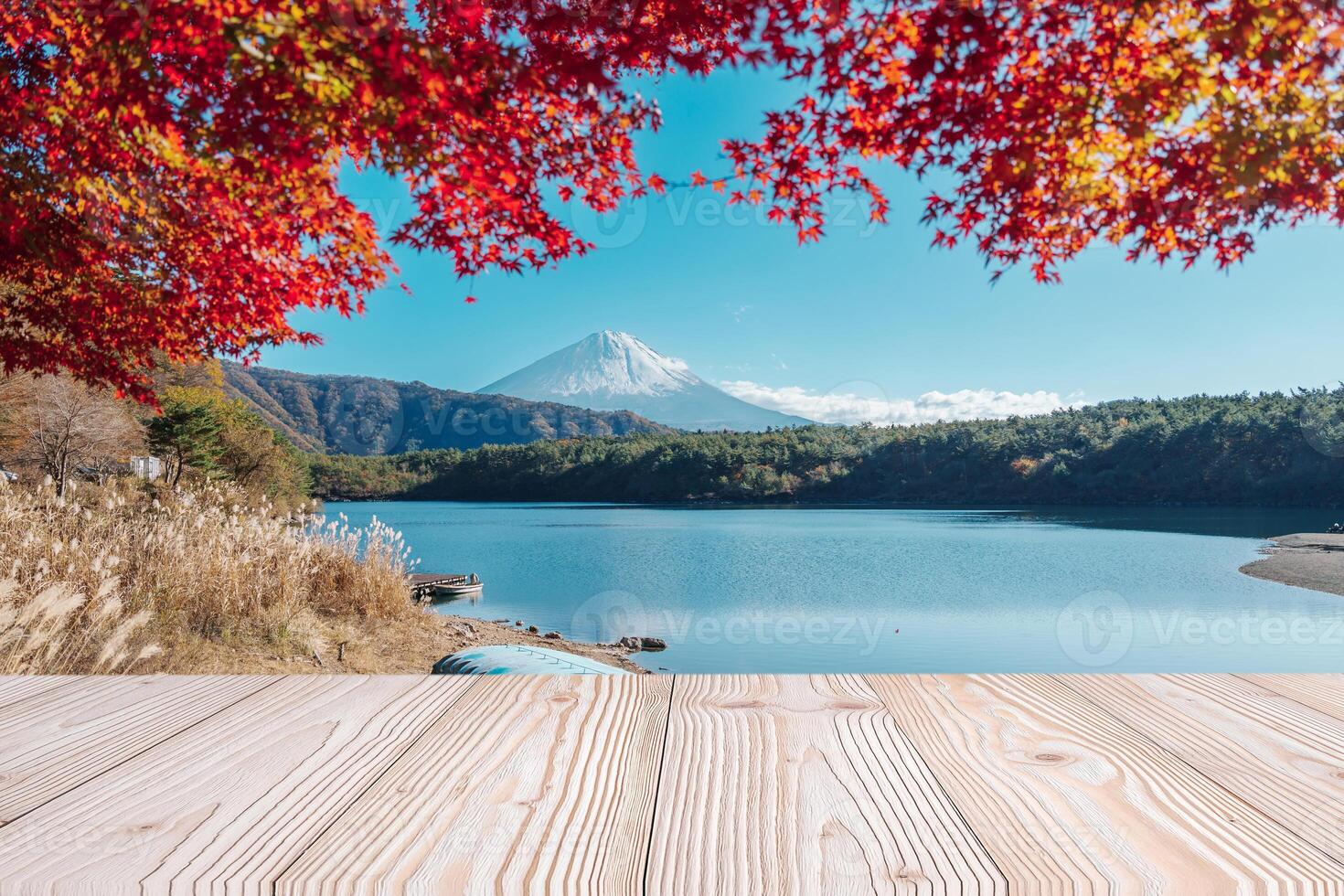 Empty wood table mockup with Mount Fuji view at Saiko lake background and copy space for text, Mock up for your product display and montage in autumn season. Japan travel and vacation concept photo