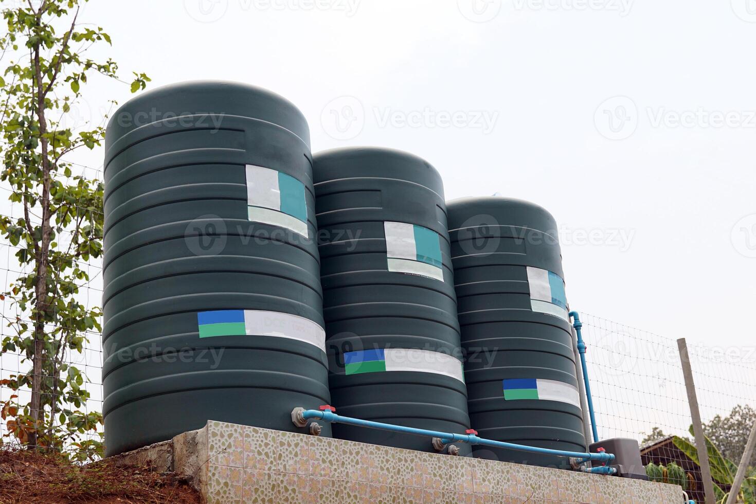 water tank installed outside the building. For use as a reserve of water for use in homes and offices. Made of special grade material, extra thick, UV protection and not moss. photo