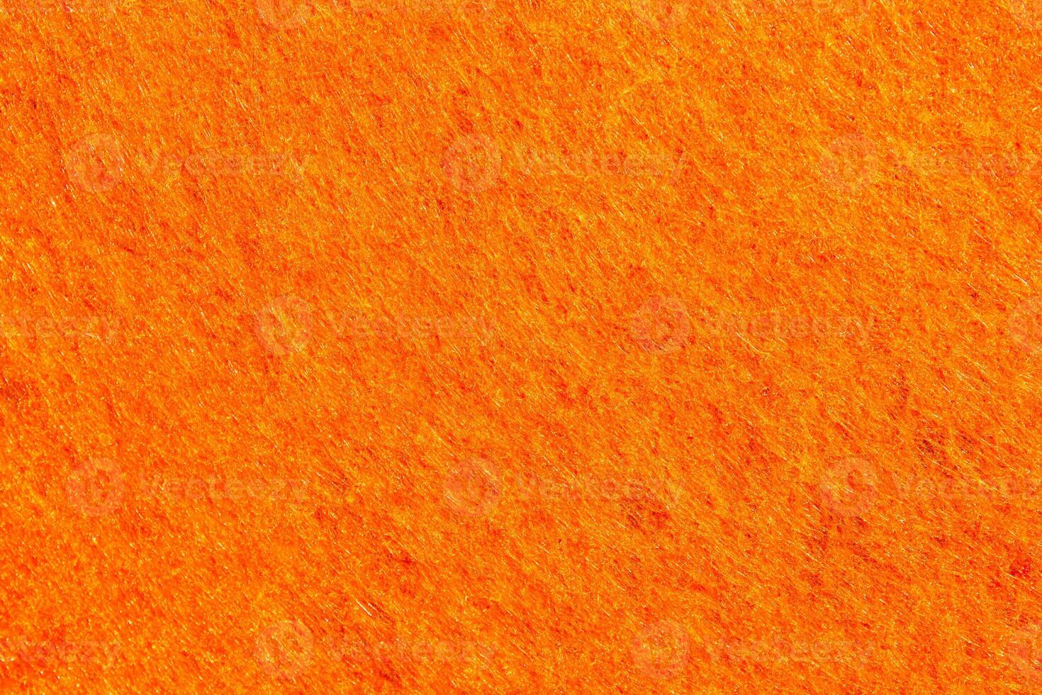 Orange felt texture with copy space, fabric background photo