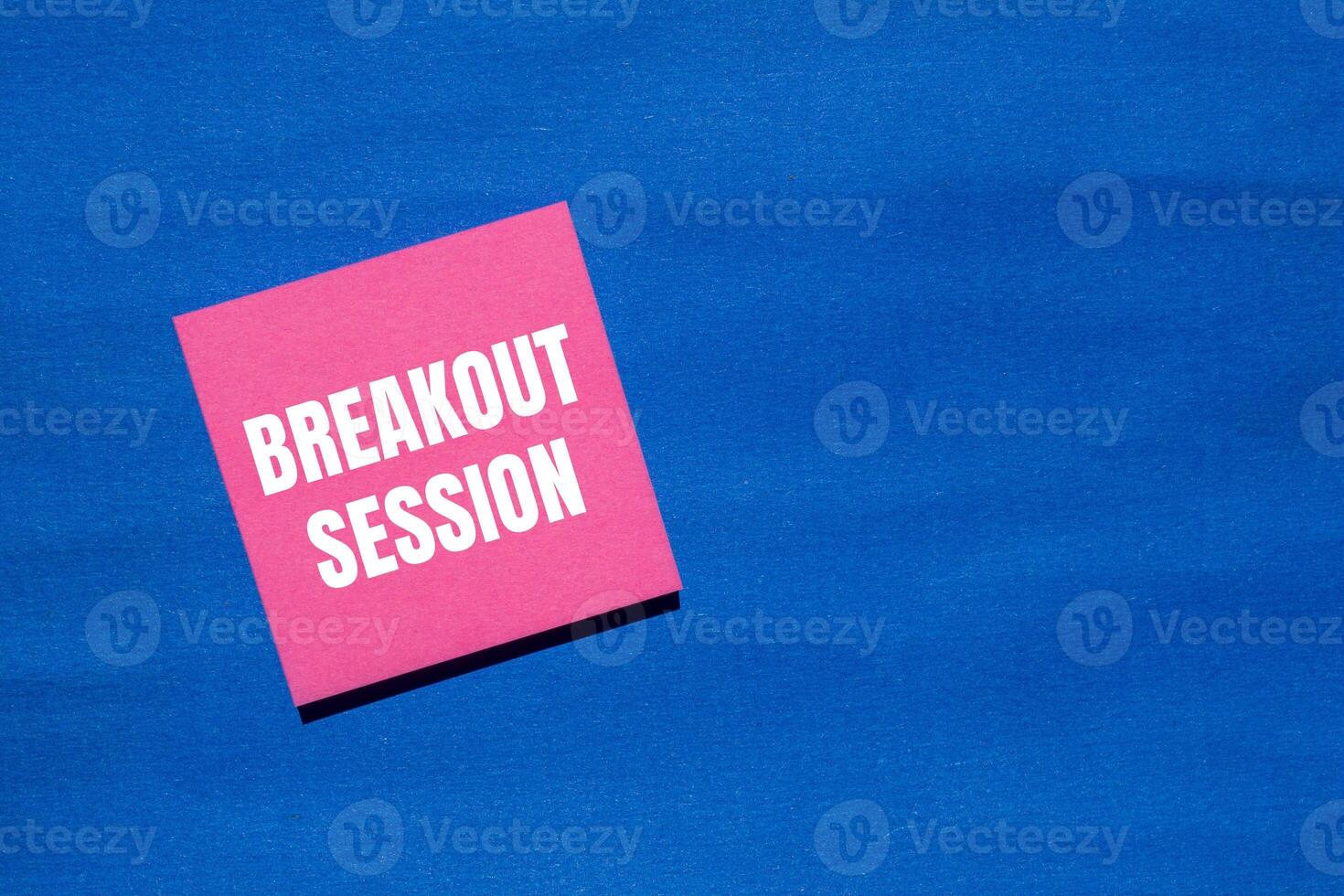Breakout session message written on pink paper with blue background. Conceptual breakout session symbol. Copy space. photo