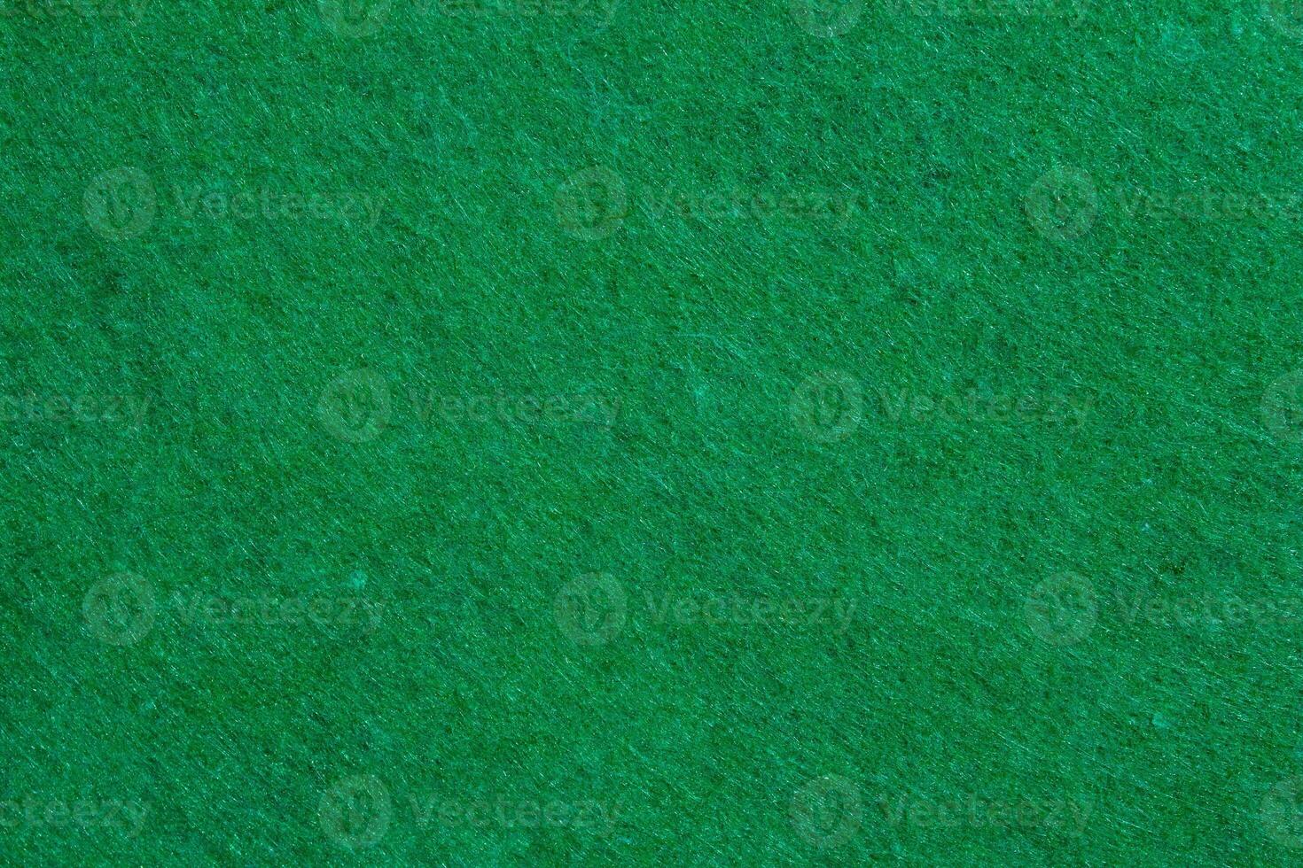 Green felt texture with copy space, fabric background photo