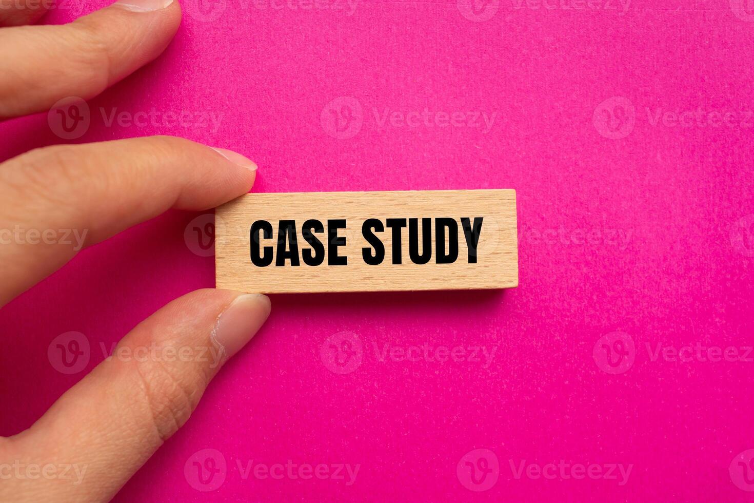 Case study message written on wooden block with pink background. Conceptual case study symbol. Copy space. photo