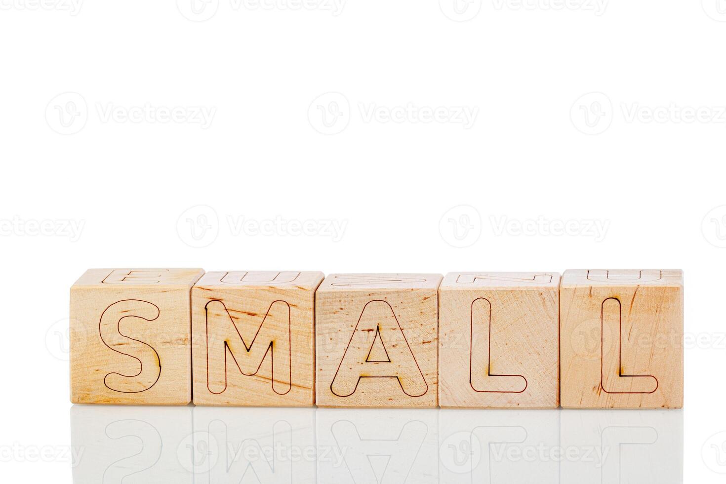 Wooden cubes with letters small on a white background photo