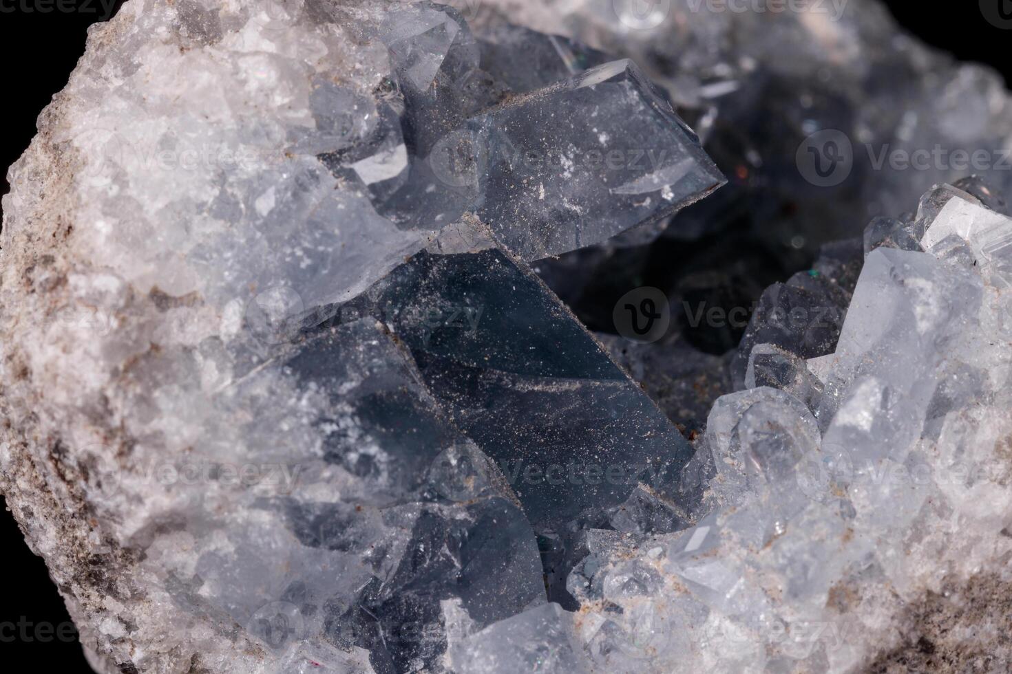 Celestine mineral stone macro on microcline on black background photo