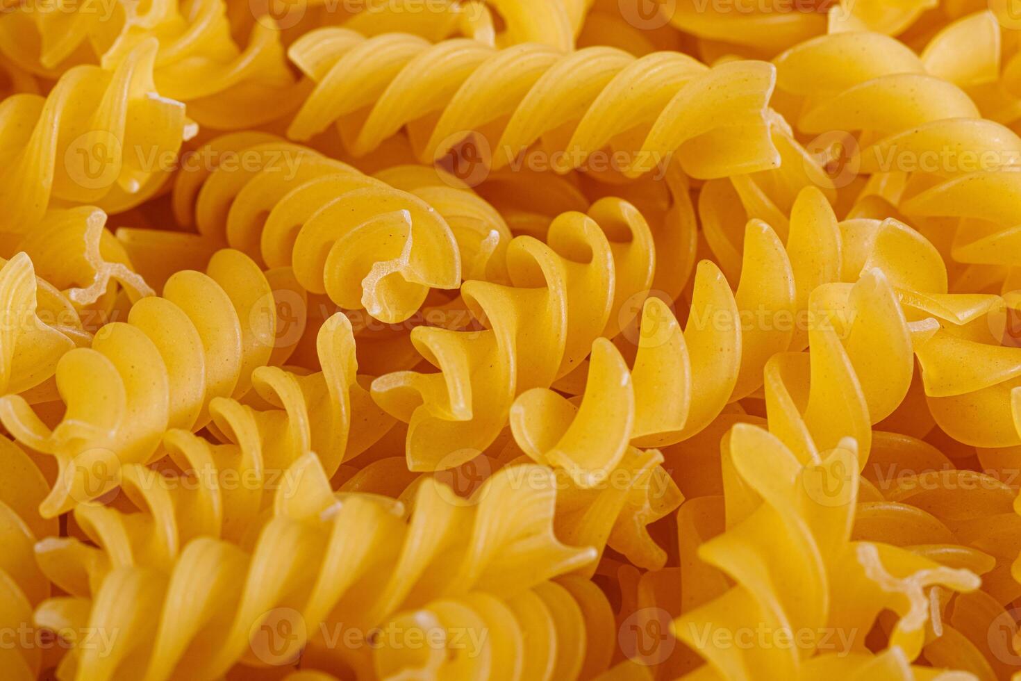 Pasta products in the form of a spiral, texture photo