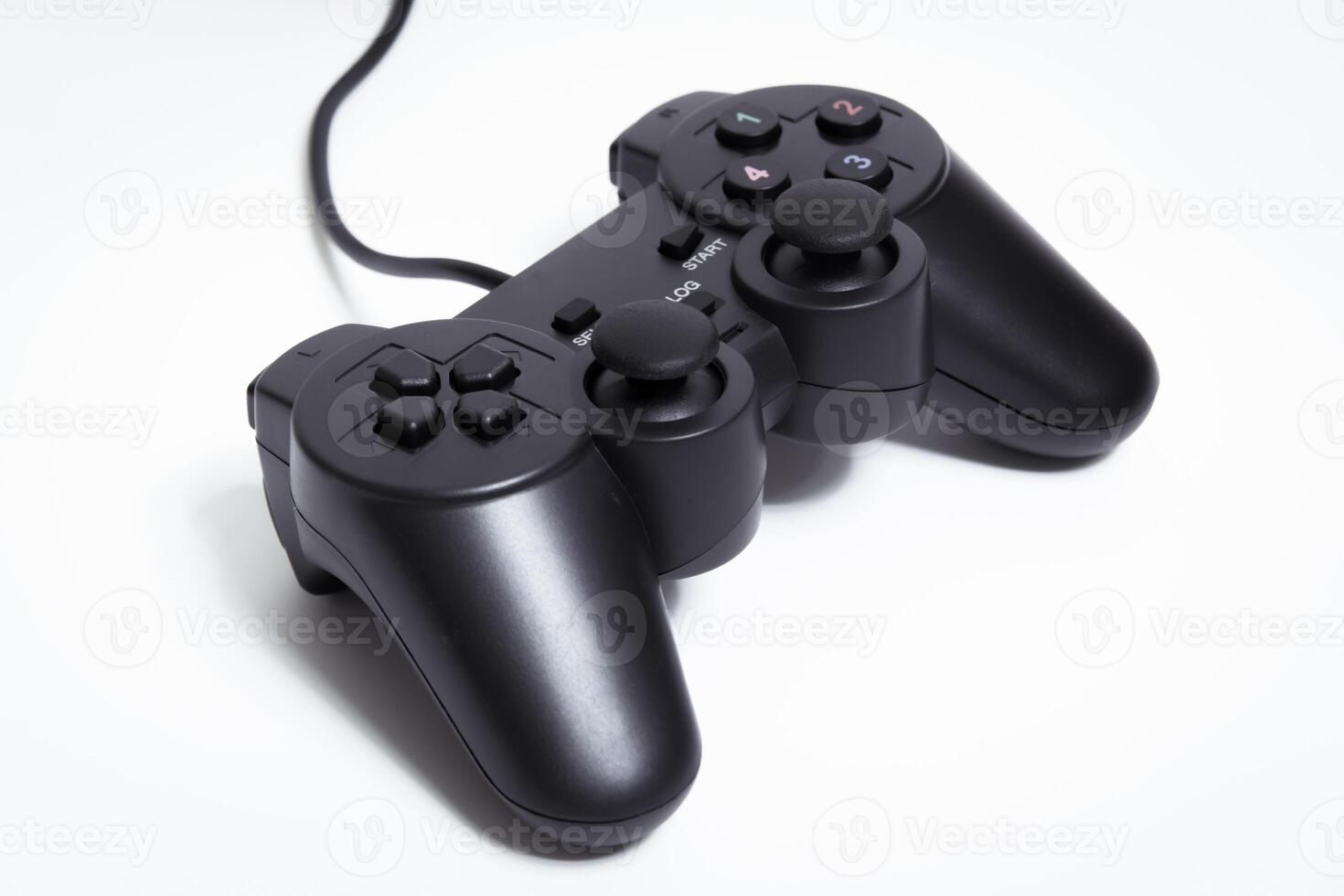 Black controller on white background, game device, Joystick on a white background. photo