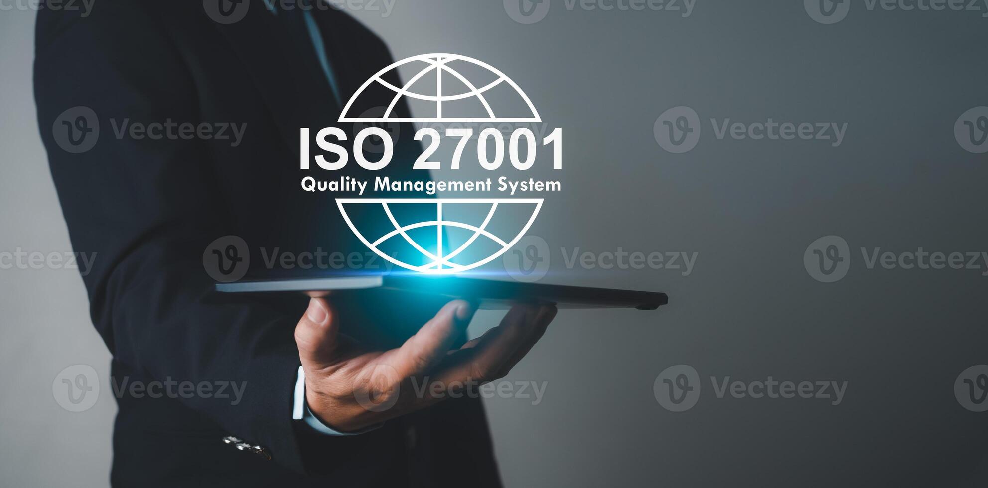 Businessman holding a tablet and showing a symbol ISO 2700, Information security management standard system, ISO 27001 certification security information standard. Requirements, Management, Standards. photo