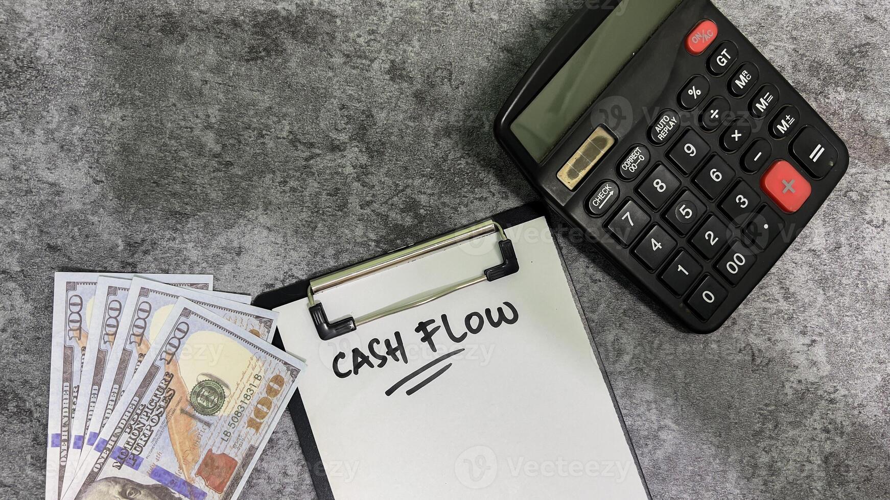 Concept of Cash flow write on paperwork isolated on wooden background. photo