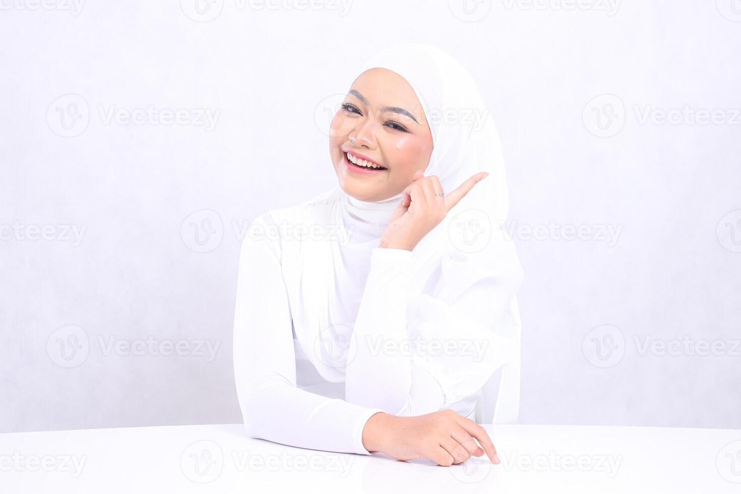 Beauty Young happy girl indonesia forward pointing left with bright, glowing and smooth skin tone. studio on isolated white background for skin care concept. beauty and health photo