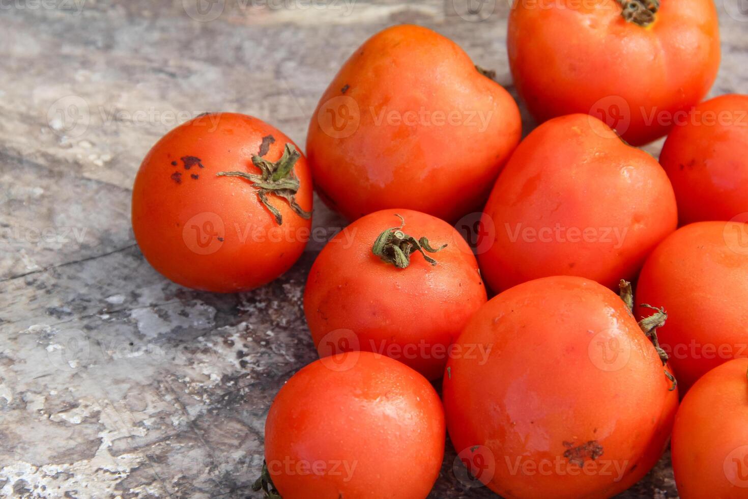 Fresh red tomatoes, the red color indicates that the tomato is ripe photo