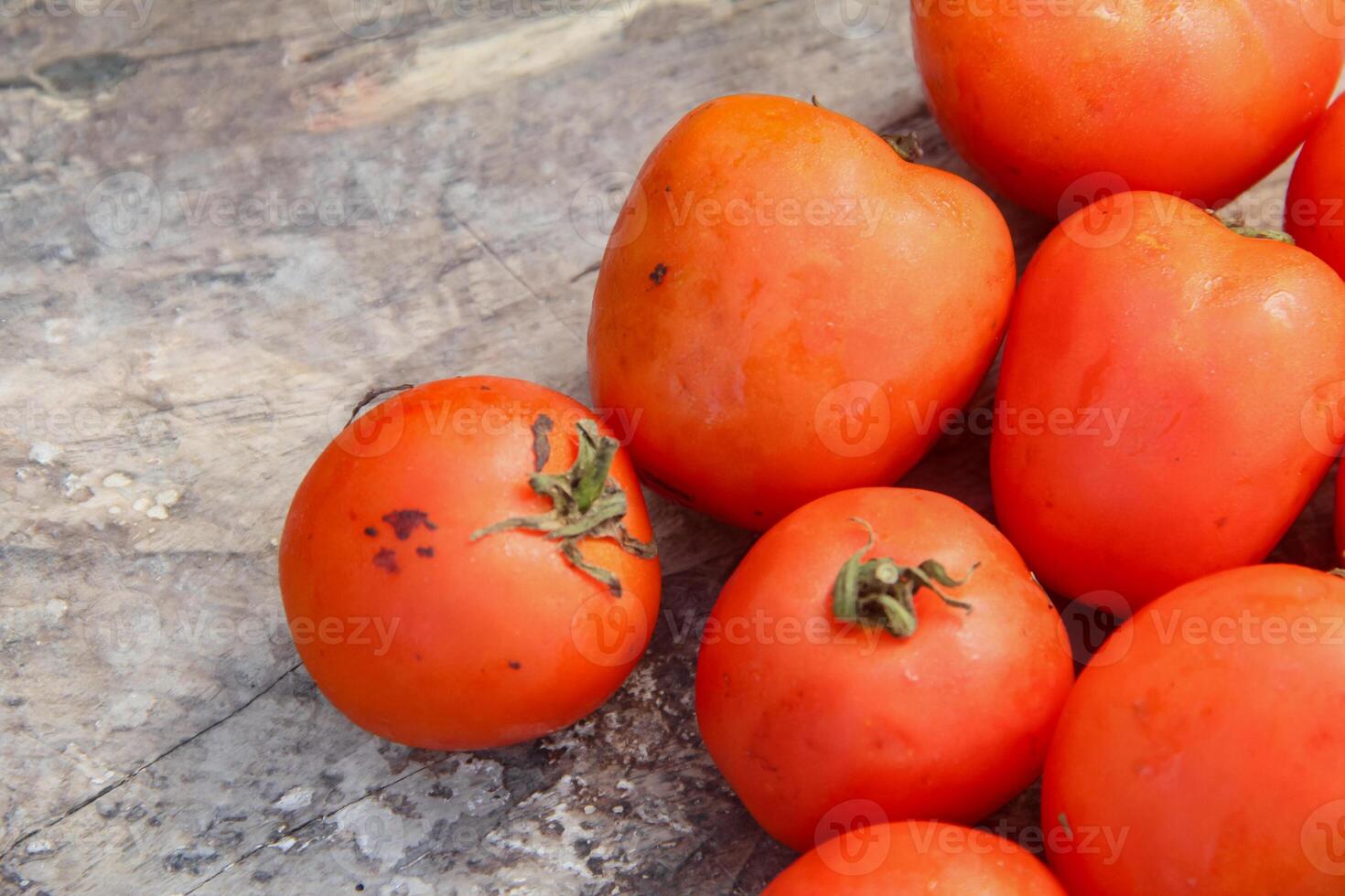 Fresh red tomatoes, the red color indicates that the tomato is ripe photo