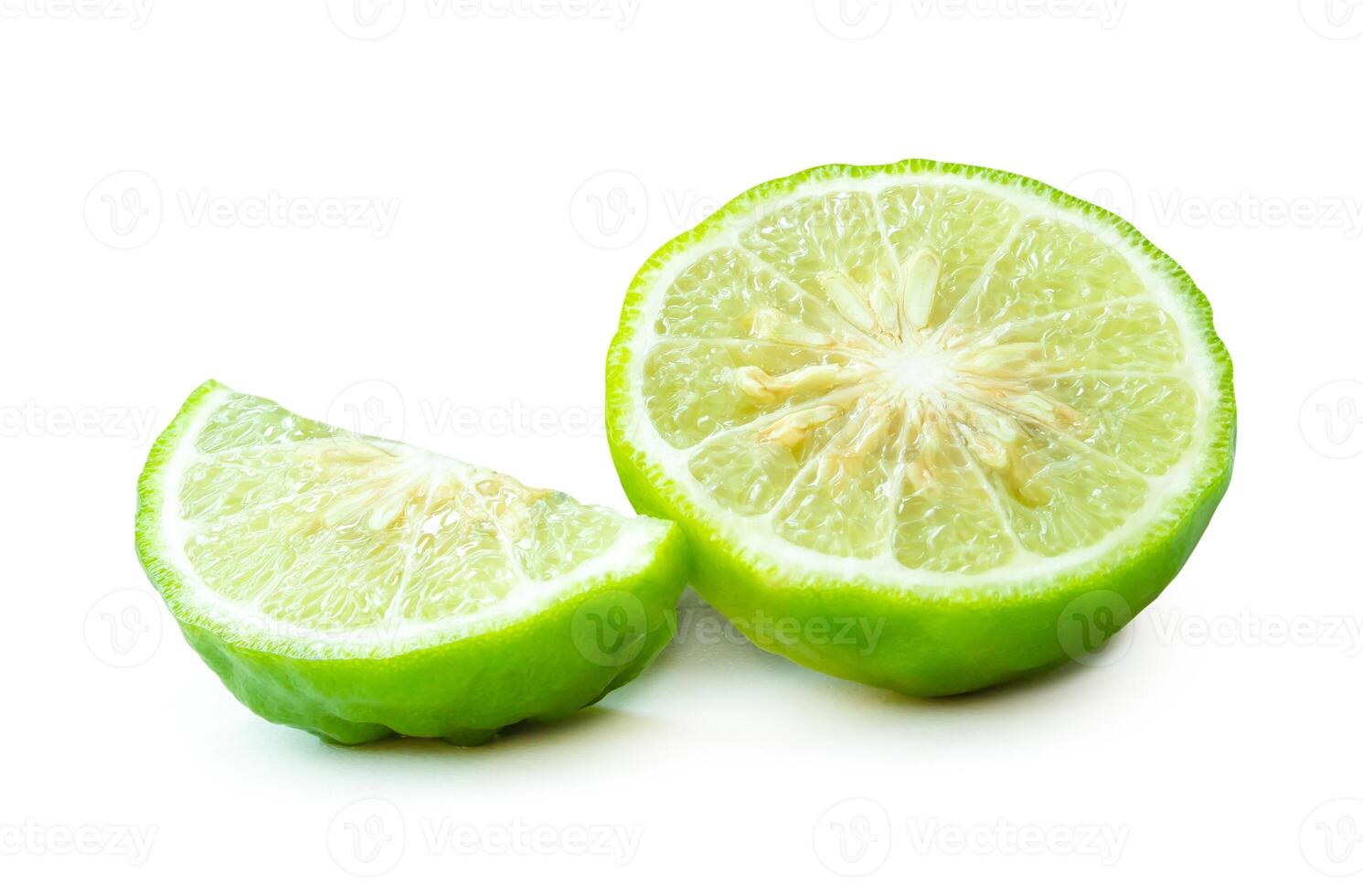 Fresh green kaffir lime fruit or bergamot in half and slice or piece isolated on white background with clipping path photo