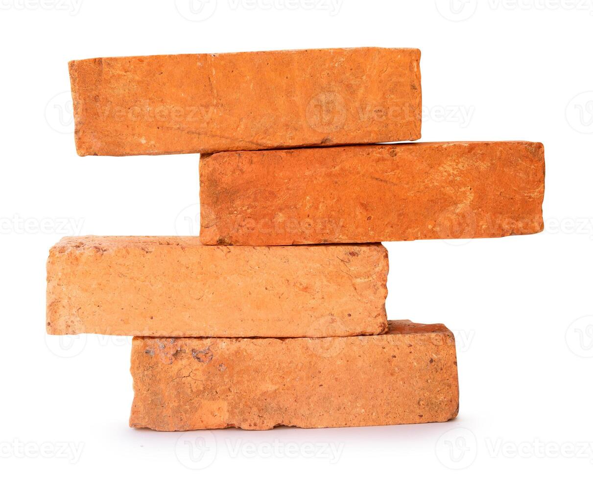 Side view of old orange or red bricks in stack isolated on white background with clipping path photo
