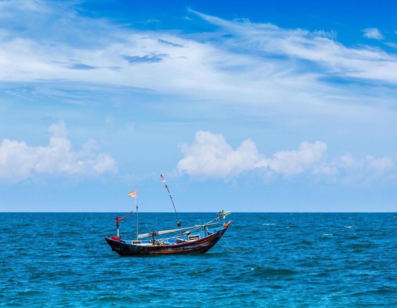 Fishing boat in sea. Mui Ne, Vietnam photo