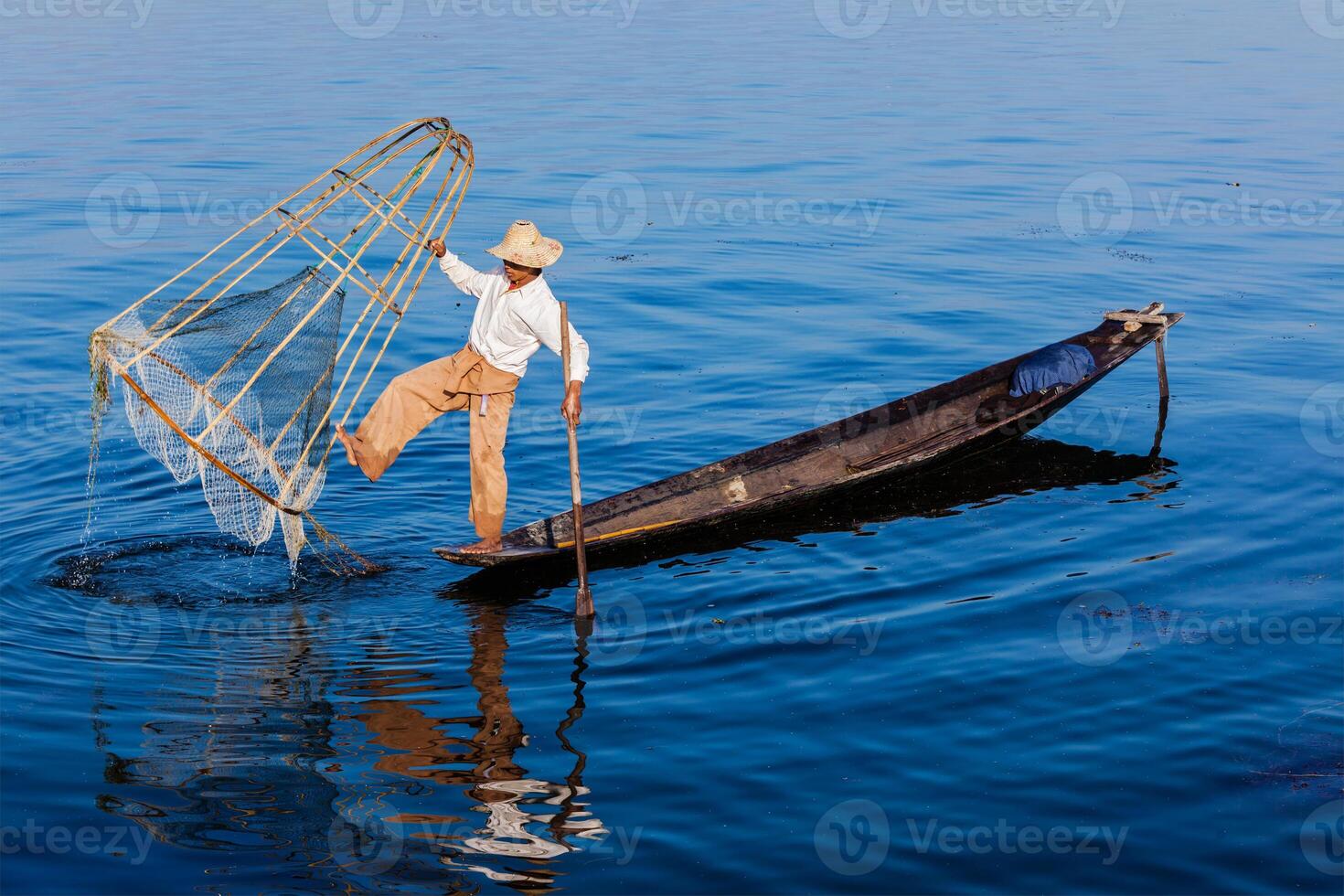 Traditional Burmese fisherman at Inle lake photo