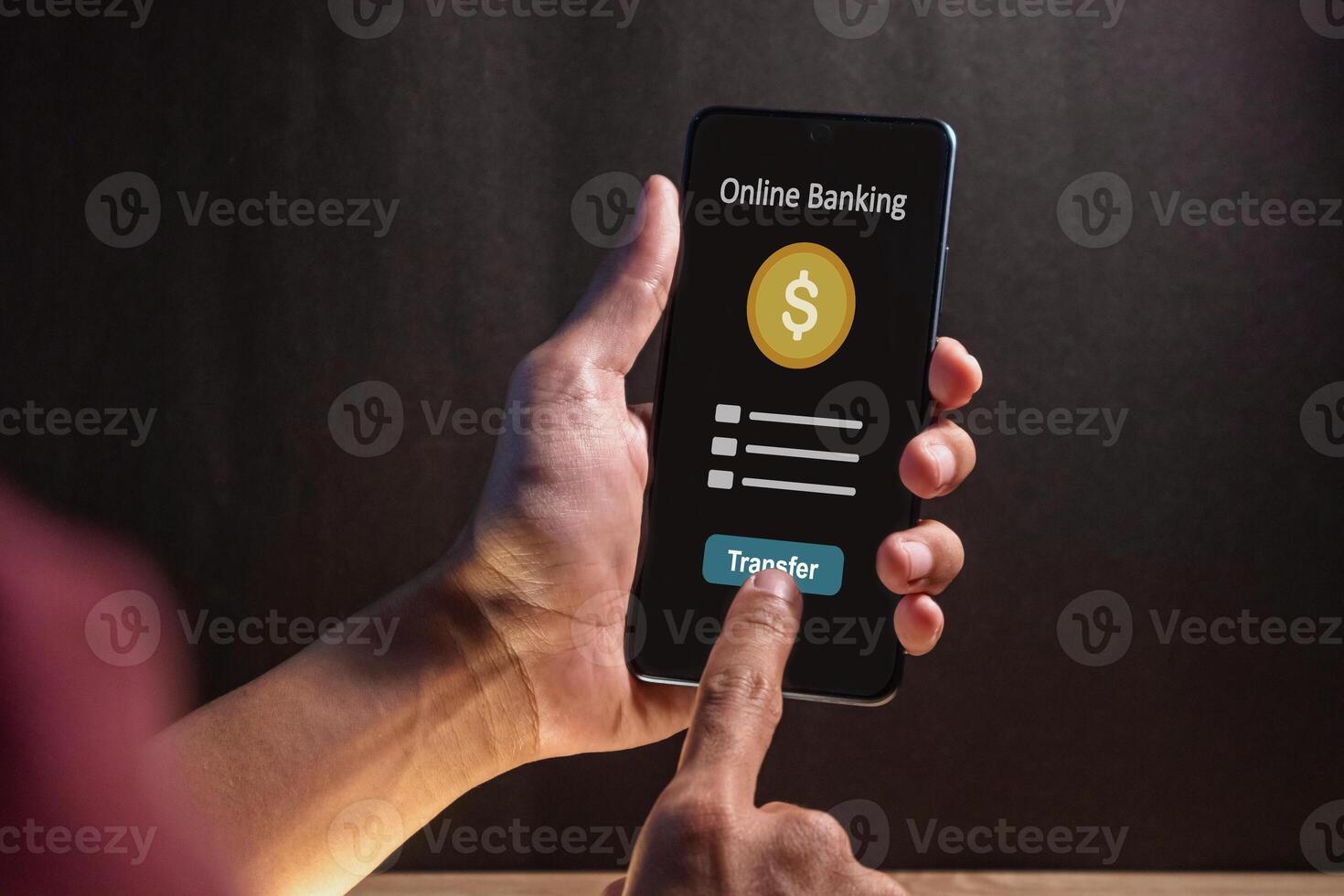 A man using a smartphone to access online mobile banking. Concept of money transfer or payment transaction. photo