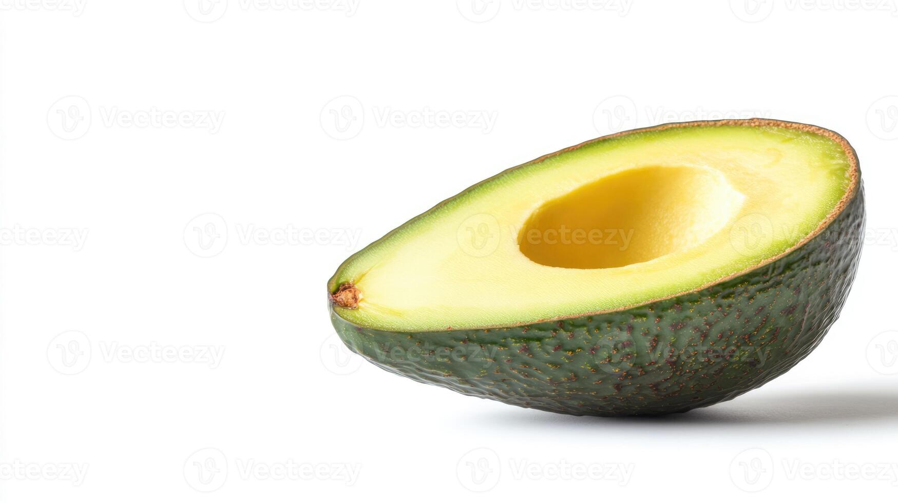 Avocado half isolated on white background with copy space. Fresh ripe cut green fruit photo