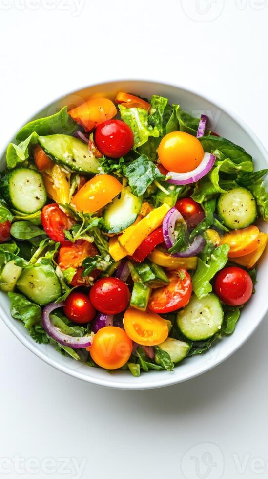 Salad with fresh summer vegetables top view on white background with copy space. Natural organic healthy vegetarian food photo