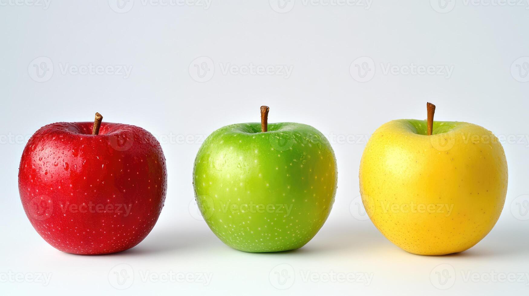Ripe fresh colorful apples with drops of water. Red, green and yellow fruits isolated on white background photo