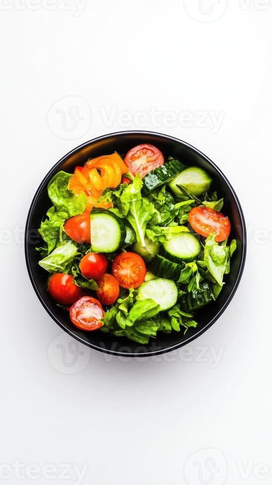 Salad with fresh summer vegetables top view on white background with copy space. Natural organic healthy vegetarian food photo