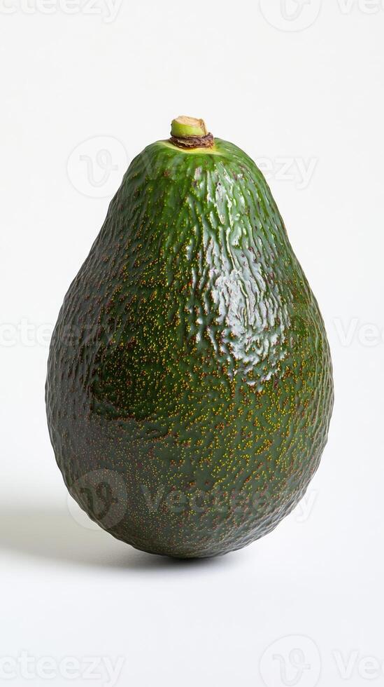 Avocado isolated on white background. Fresh ripe whole green fruit, vertical image photo