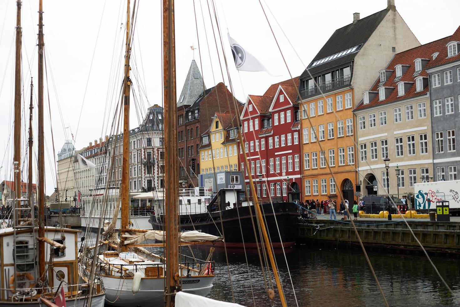 Copenhagen, Denmark - August 22, 2024. Colourful, captivating Nyhavn is one of the most iconic sights. photo