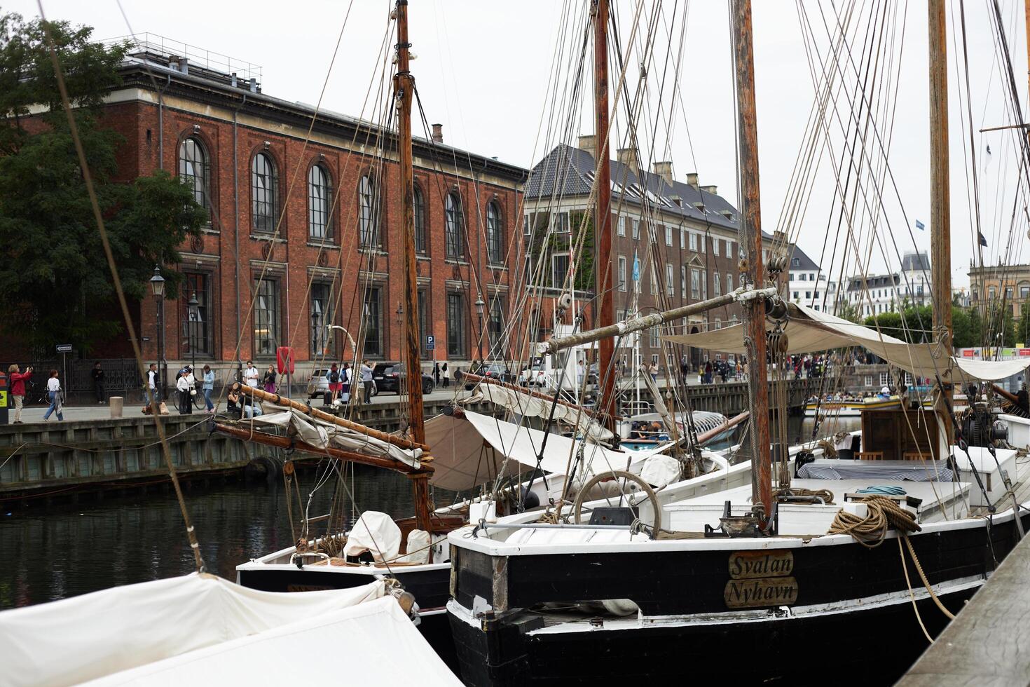 Copenhagen, Denmark - August 22, 2024. Colourful, captivating Nyhavn is one of the most iconic sights. photo