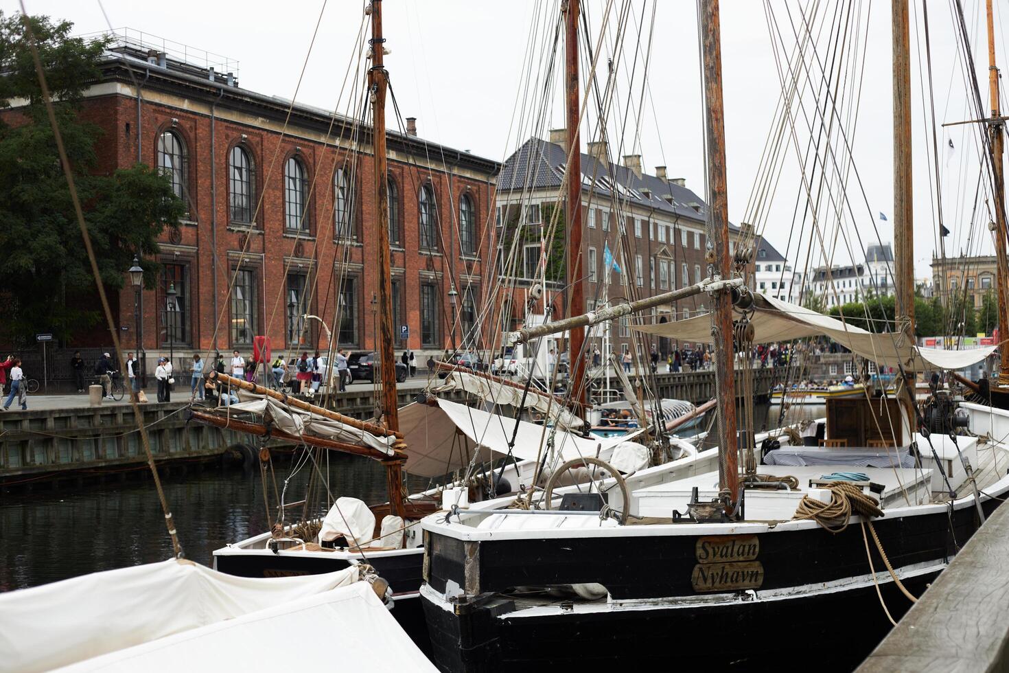 Copenhagen, Denmark - August 22, 2024. Colourful, captivating Nyhavn is one of the most iconic sights. photo