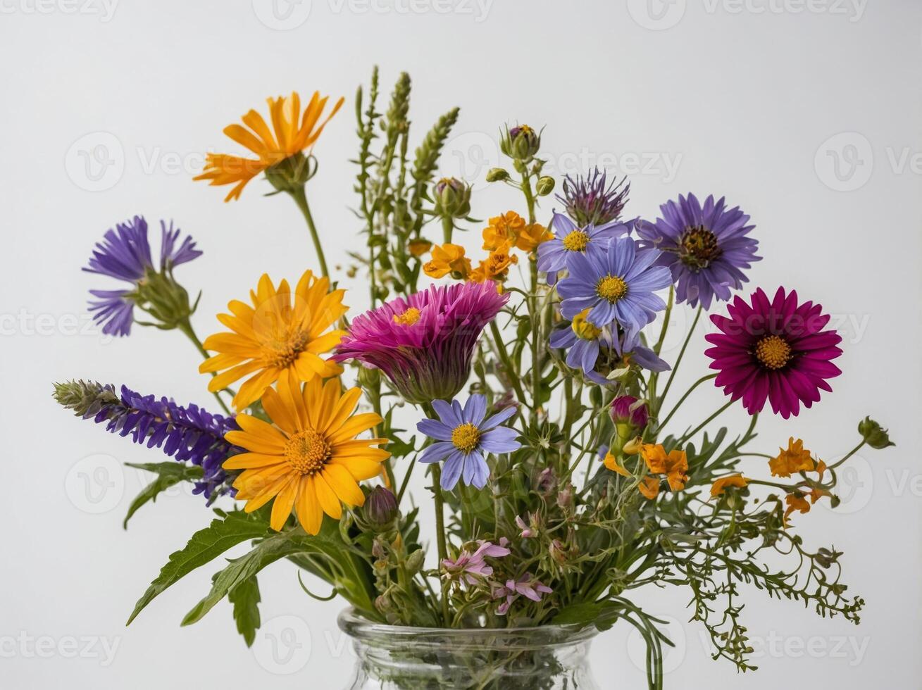 A vibrant bouquet of various colorful flowers arranged in a glass vase against a plain backdrop photo