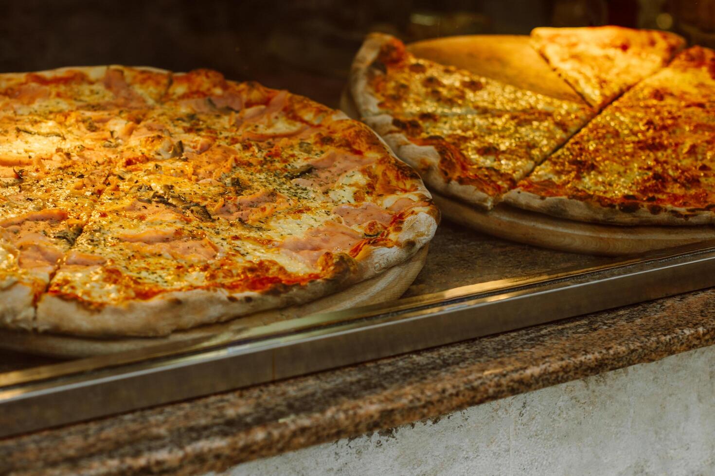 Delicious pizza in a traditional Italian pizzeria. Selective focus. photo