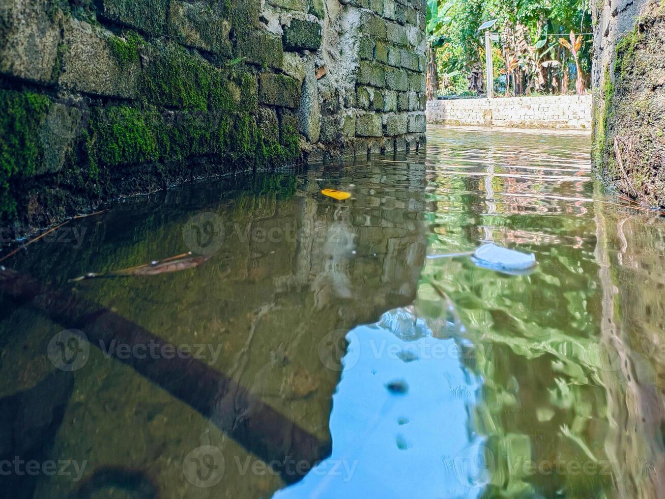 Beautiful small streams flow through a resort, offering a picturesque view at Kemensah. This recreation spot is a must-visit tourist attraction for nature enthusiasts. photo