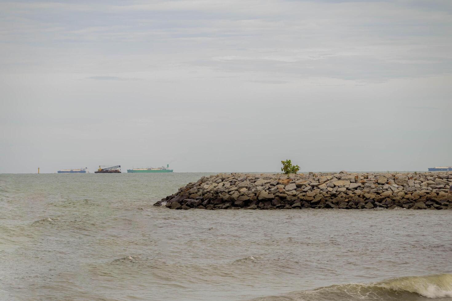 The breathtaking Pengkalan Balak beach in Malaysia is a beautiful stretch of coastline with powdery natural sand, bright sea waters, and serene surroundings that provide a sense of pure bliss. photo