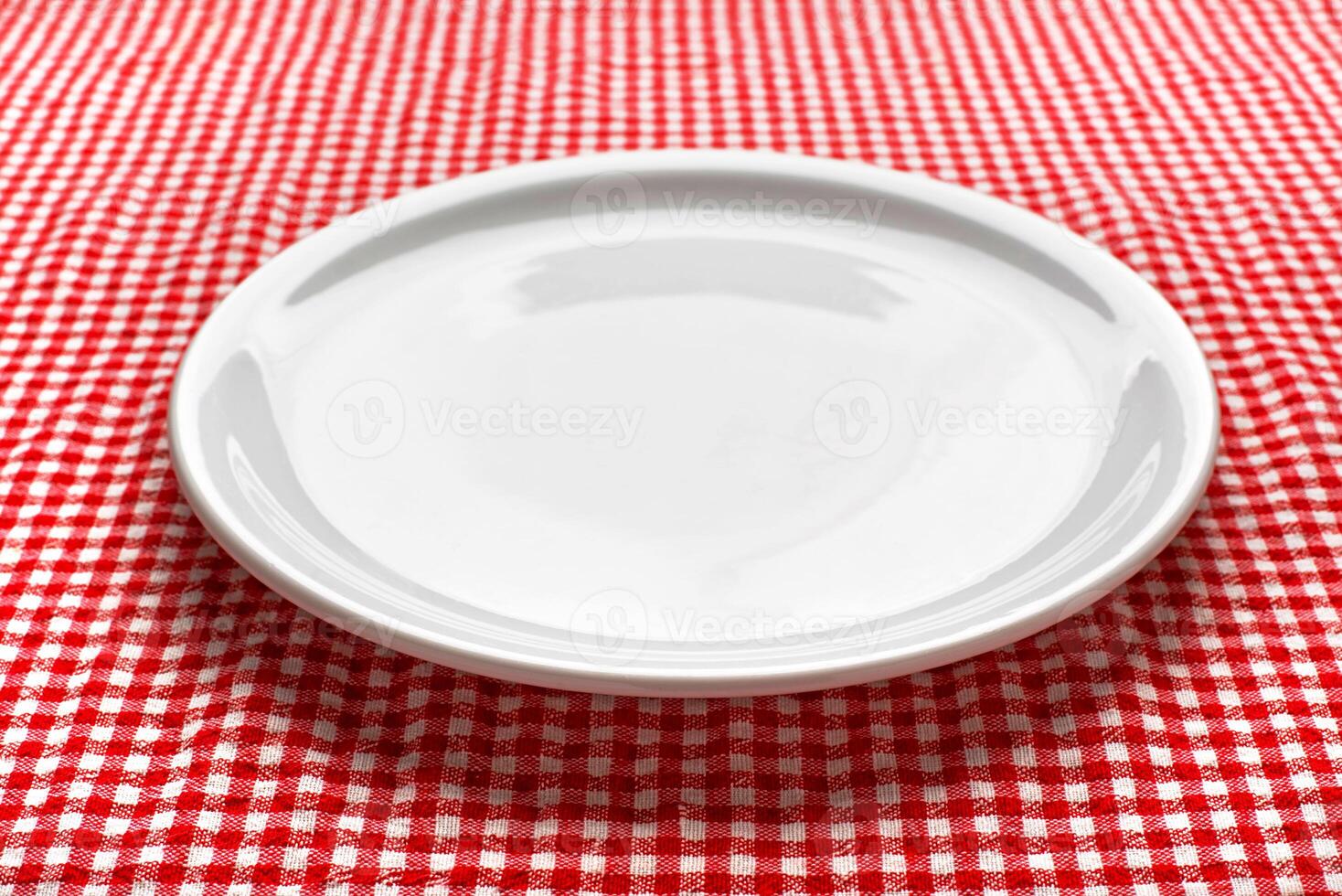 Empty plate on kitchen table photo