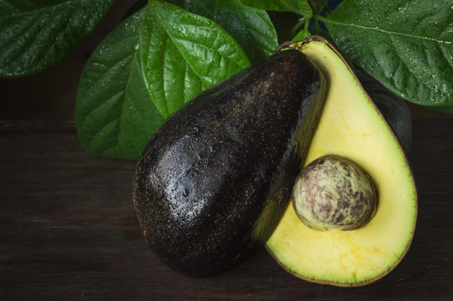 a half of an avocado sitting on a table photo