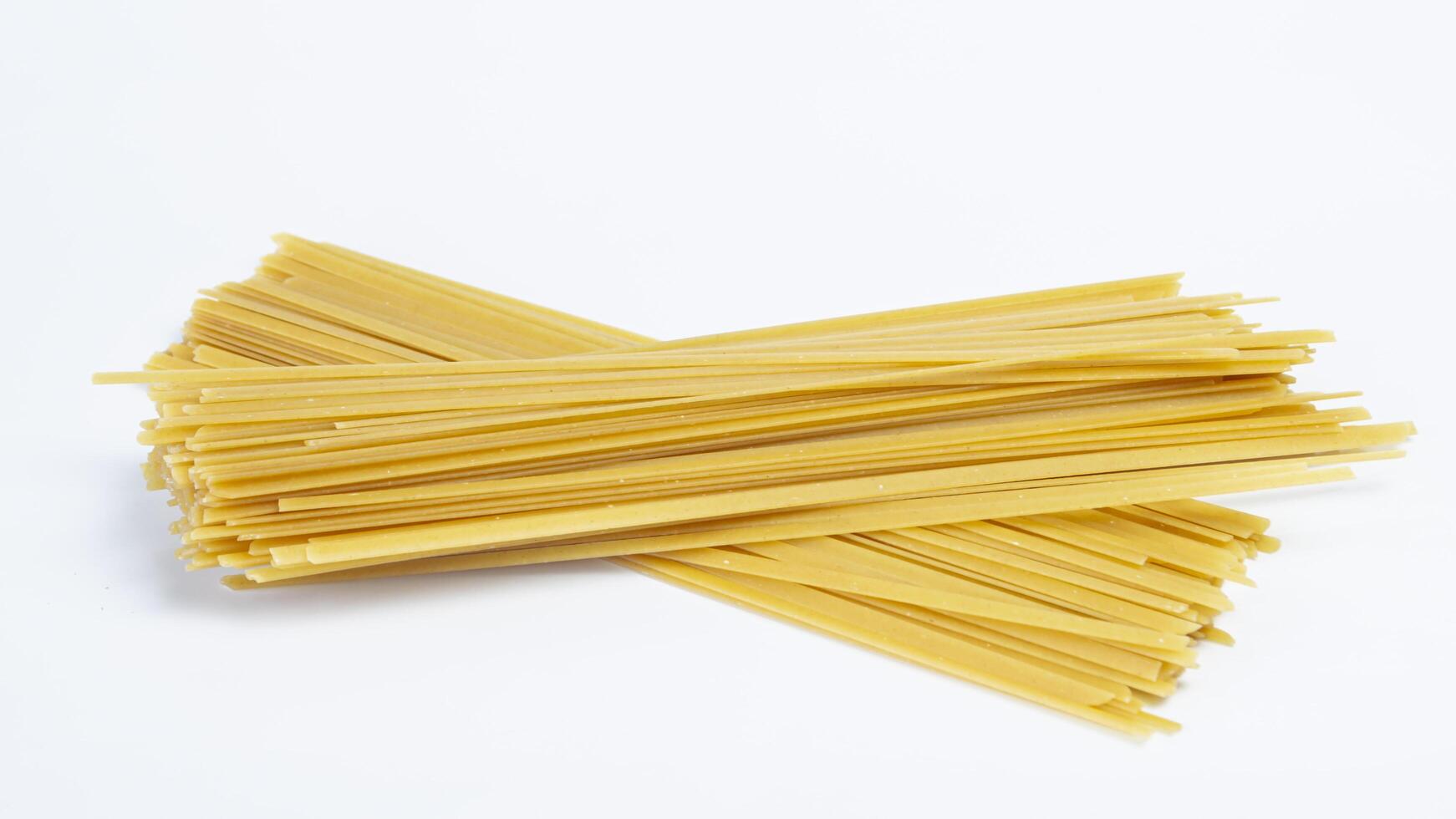 a bundle of spaghetti tied with twine photo