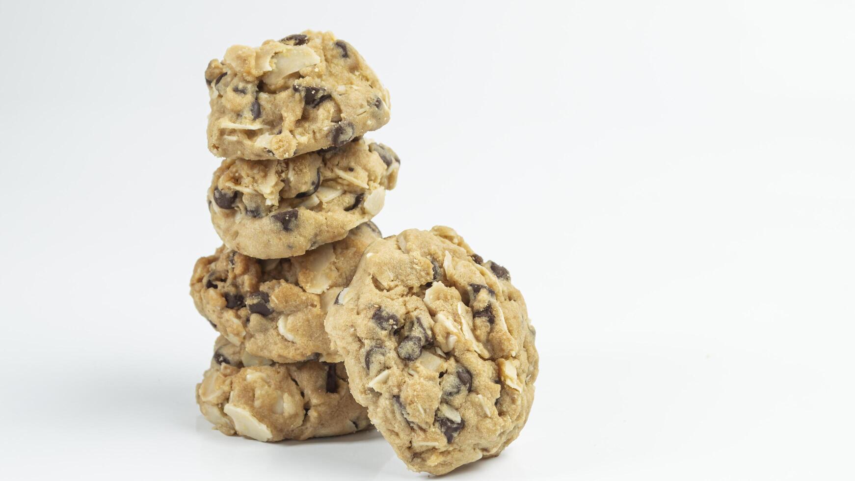 a stack of cookies with chocolate chips on top photo