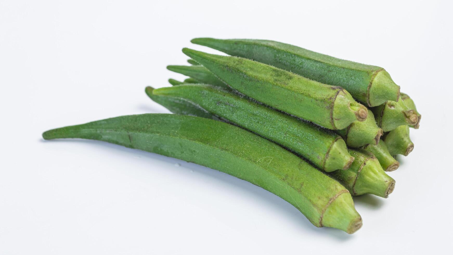 A pile okra on white background photo