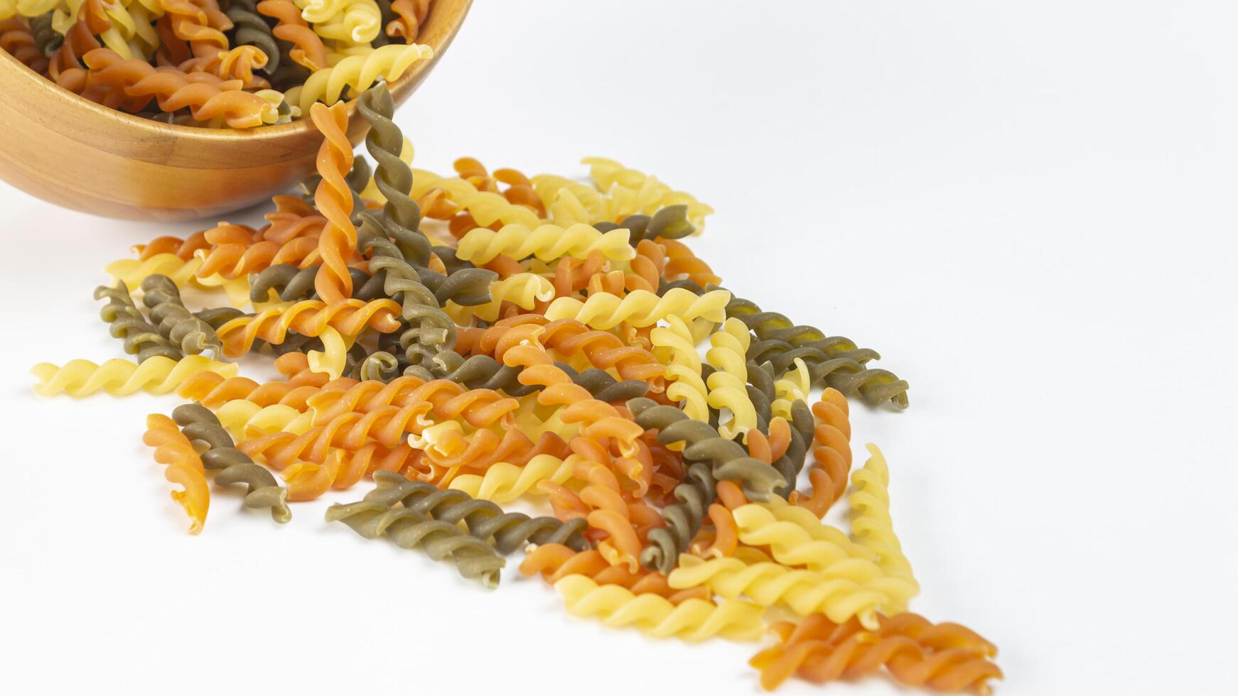 a bowl of colorful dry pasta photo
