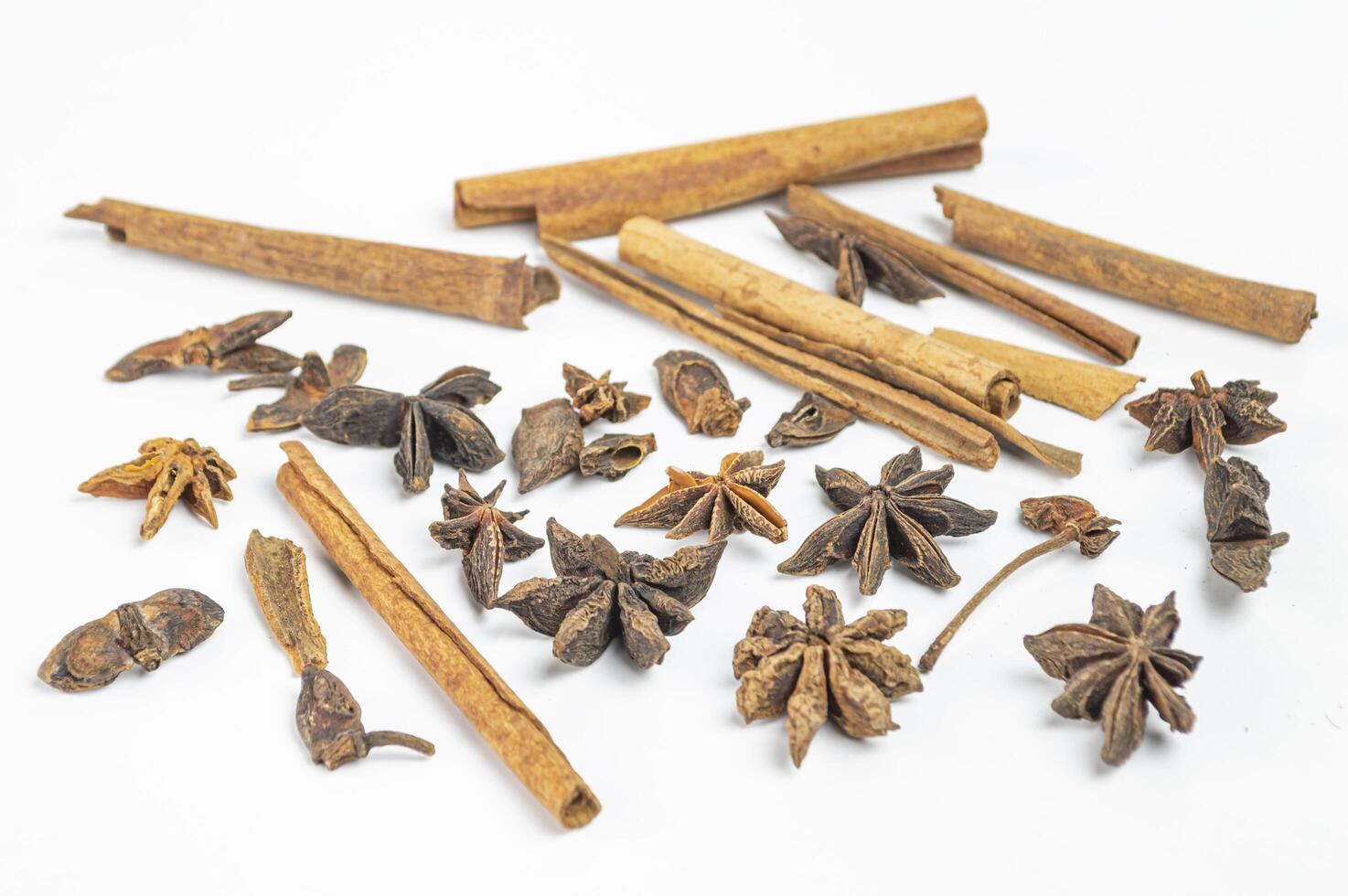 an assortment of dried spices and star anise photo