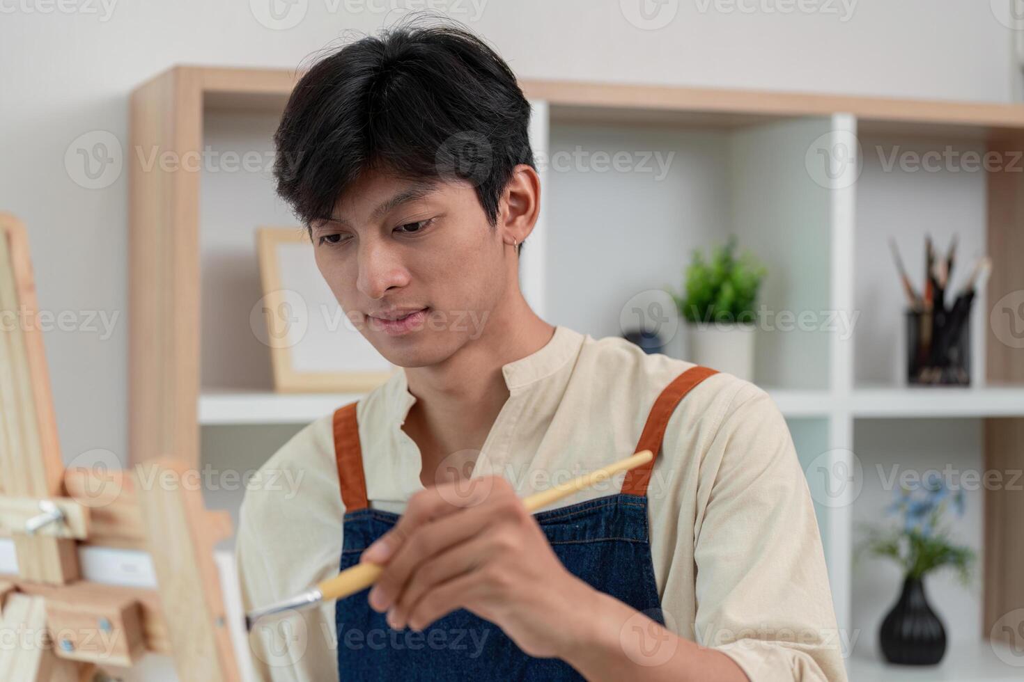 Artist concentrating on creating artwork at home photo