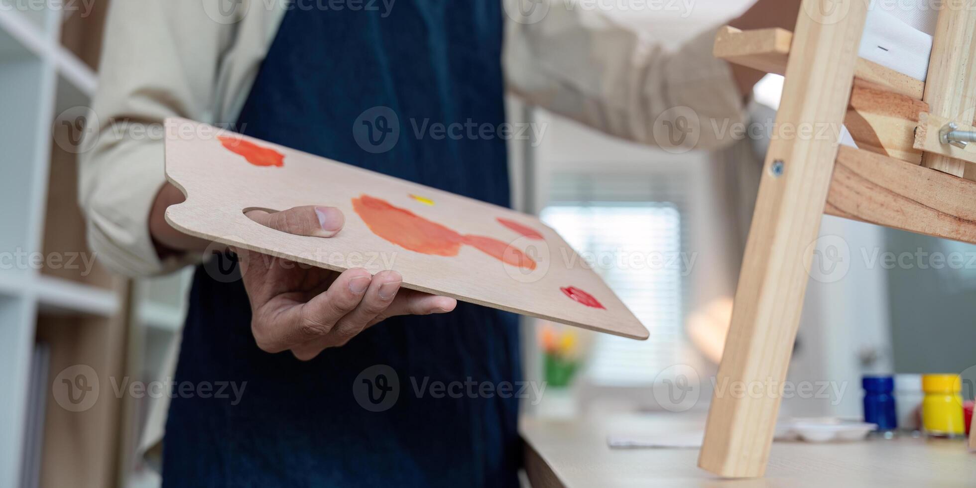 Artist organizing palette for creative project at home photo