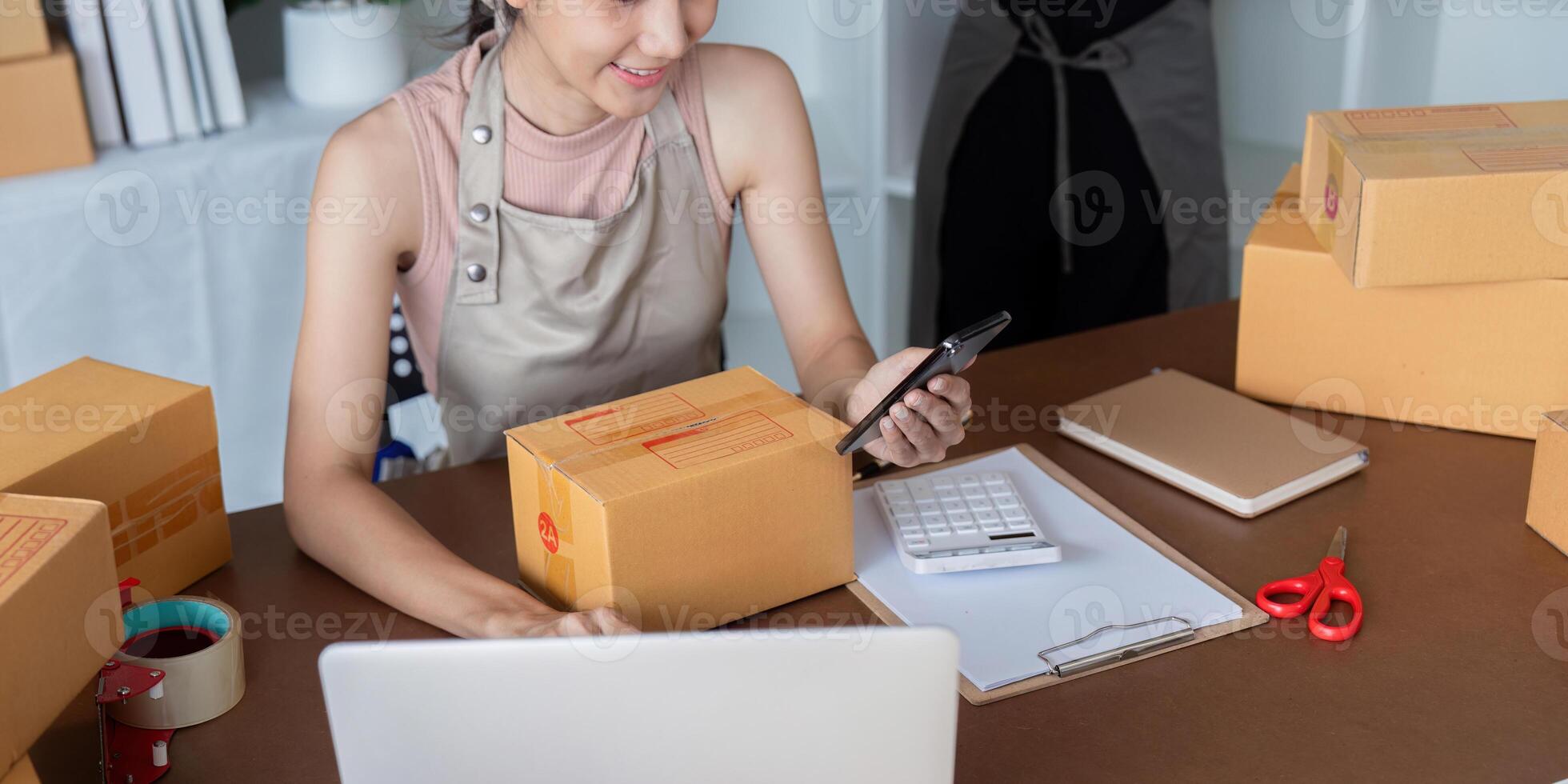 Women using technology for efficient ecommerce packaging photo